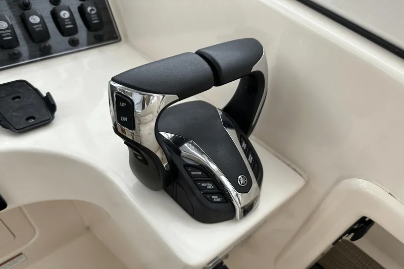 Slide: The Image of Yamaha throttle control on 2022 Grady-White 275 Freedom boat dashboard. - 26