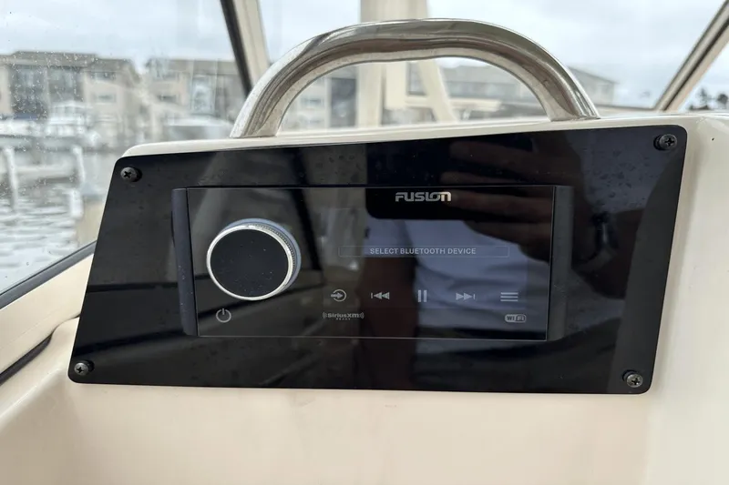 Slide: The Image of Fusion audio system on 2022 Grady-White 275 Freedom boat dashboard. - 28