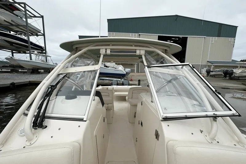 Slide: The Image of 2022 Grady-White 275 Freedom boat docked near storage facility. - 32