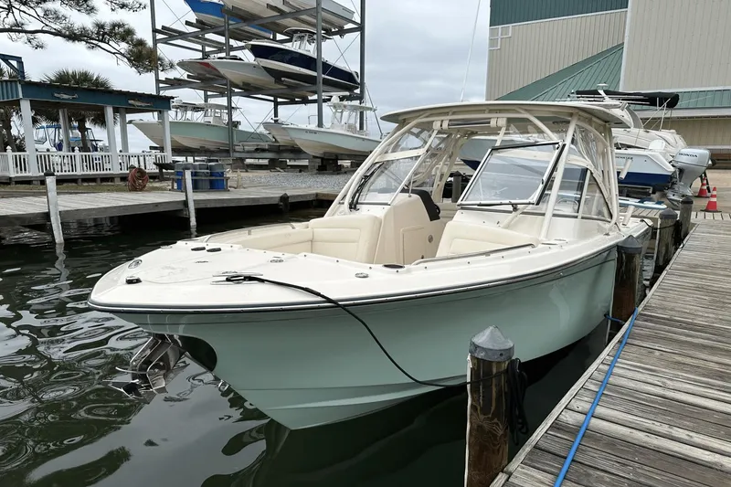 Slide: The Image of 2022 Grady-White 275 Freedom boat docked at marina. - 4