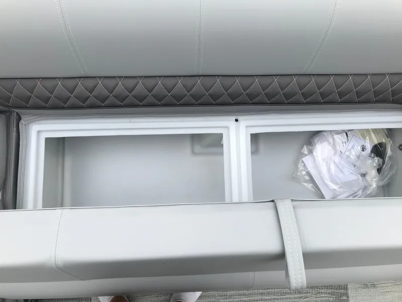 Slide: The Image of 2024 Ranger Reata 223C storage compartment with quilted upholstery. - 10