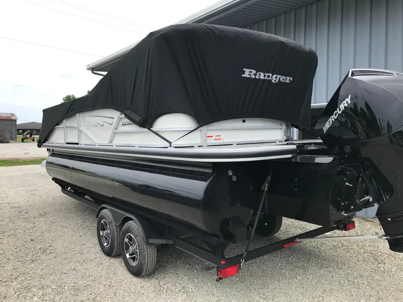 Slide: The Image of 2024 Ranger Reata 223C pontoon boat with cover and Mercury outboard motor. - 14