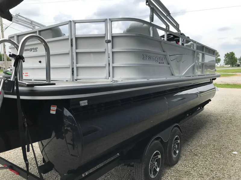 Slide: The Image of 2024 Ranger Reata 223C pontoon boat on a trailer. - 3