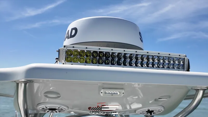 Slide: The Image of 2020 Costa Custom Boats 264 HC with radar and LED light bar on a sunny day. - 13