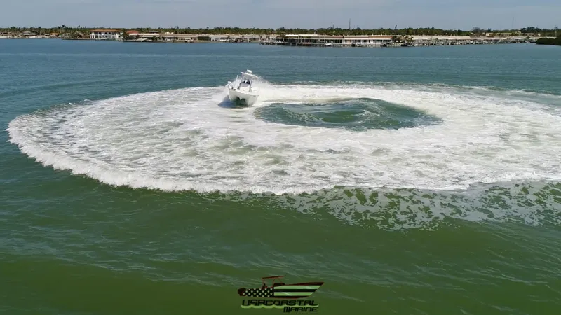 Slide: The Image of Costa Custom Boats 264 HC making waves in open water, 2020 model. - 16