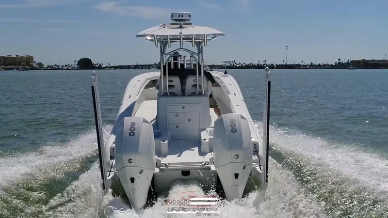 Slide: The Image of 2020 Costa Custom Boats 264 HC cruising on open water, rear view. - 18