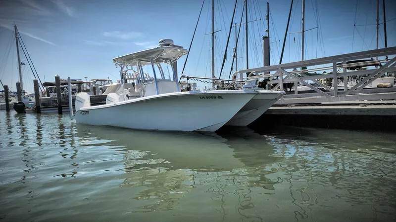 Slide: The Image of 2020 Costa Custom Boats 264 HC docked at marina under clear blue sky. - 28