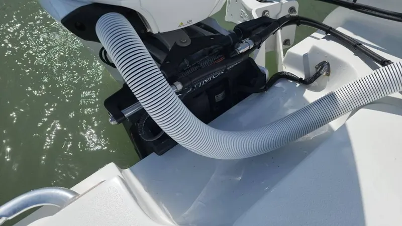 Slide: The Image of 2020 Costa Custom Boats 264 HC with motor and hose detail on water. - 29
