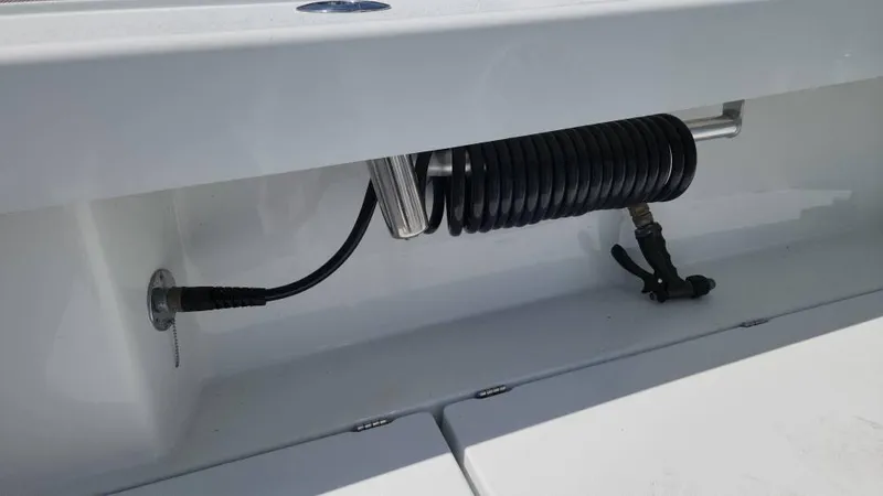Slide: The Image of Coiled hose storage on 2020 Costa Custom Boats 264 HC deck. - 32