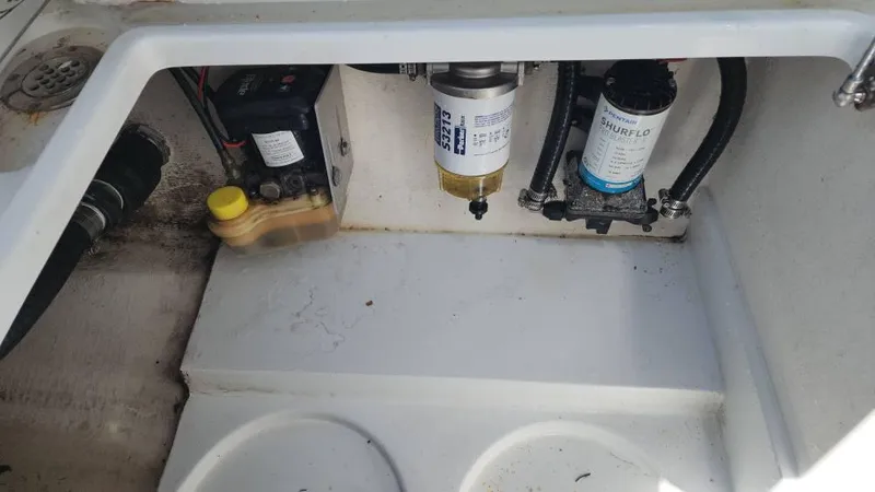 Slide: The Image of 2020 Costa Custom Boats 264 HC engine compartment with fuel filter and pump components. - 33