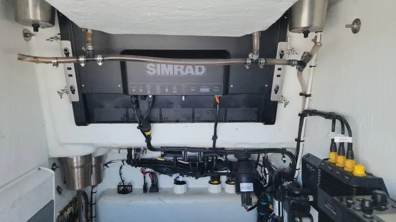Slide: The Image of Engine compartment of 2020 Costa Custom Boats 264 HC with Simrad electronics. - 40