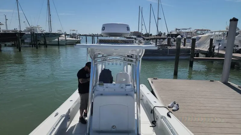 Slide: The Image of 2020 Costa Custom Boats 264 HC docked at a marina with clear skies. - 42