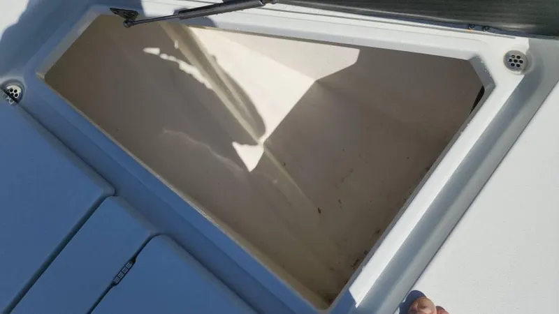 Slide: The Image of Open storage compartment on a 2020 Costa Custom Boats 264 HC. - 46