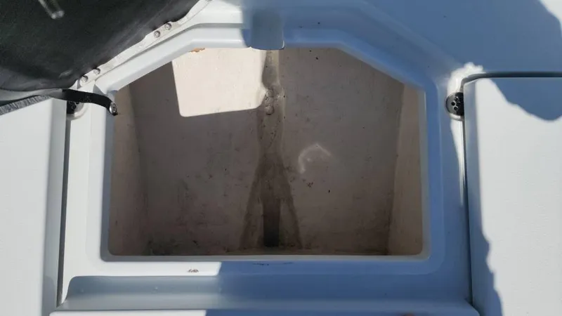 Slide: The Image of Open storage compartment on a 2020 Costa Custom Boats 264 HC. - 48