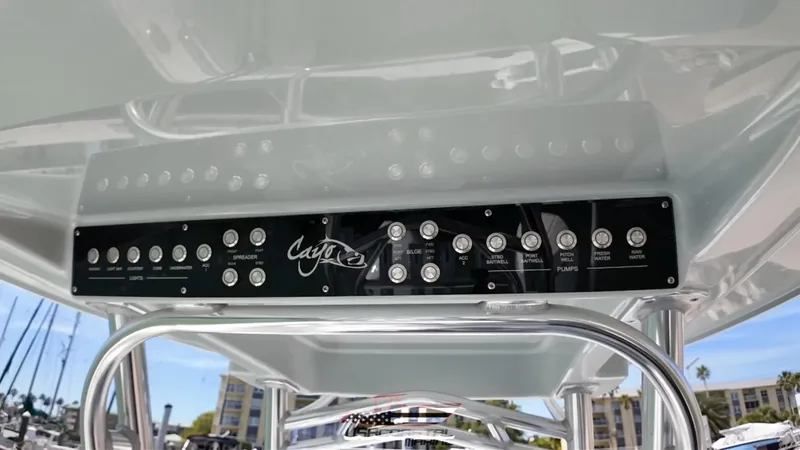 Slide: The Image of Control panel of 2020 Costa Custom Boats 264 HC, featuring various switches and buttons. - 7