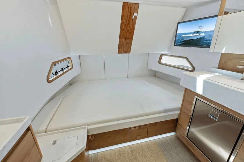 Slide: The Image of Interior of 2024 Bertram 39 CC with bed and TV. - 49