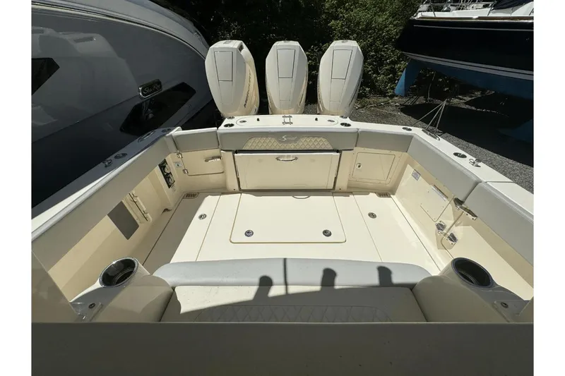 Slide: The Image of 2024 Scout 357LXF boat interior with seating and storage compartments. - 5