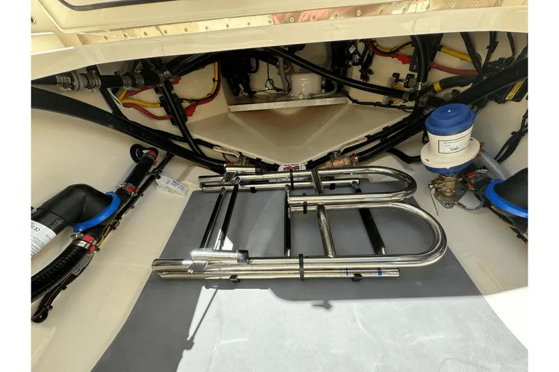 Slide: The Image of 2024 Scout 357LXF boat interior showing mechanical components and wiring. - 30