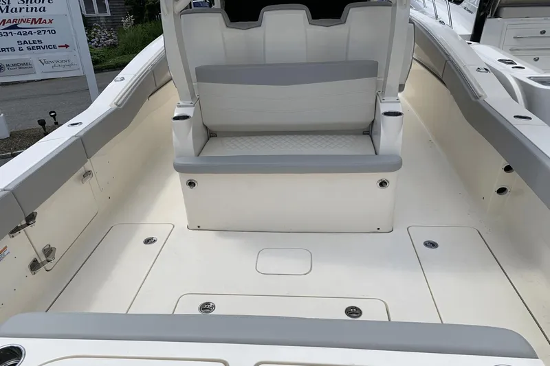 Slide: The Image of 2024 Scout 357LXF boat interior with seating and storage compartments. - 10
