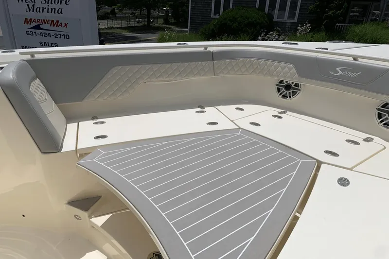 Slide: The Image of 2024 Scout 357LXF boat interior with cushioned seating and stylish design. - 20