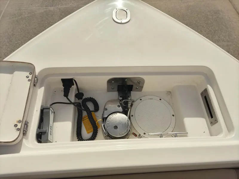 Slide: The Image of 2020 Sailfish 275 DC boat anchor locker with winch and storage compartment. - 13