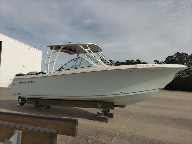 Slide: The Image of 2020 Sailfish 275 DC boat on trailer, parked outdoors. - 2