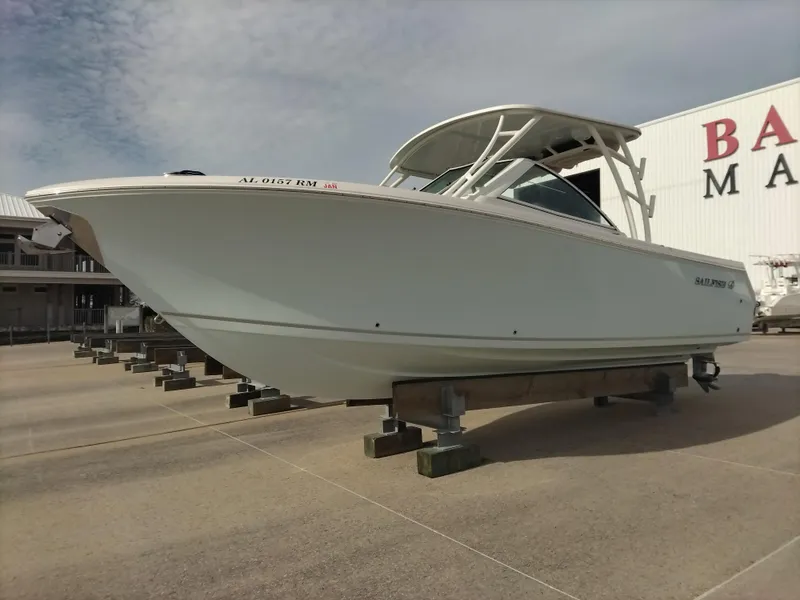 Slide: The Image of 2020 Sailfish 275 DC boat on display at a marina. - 3