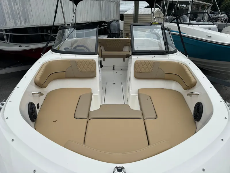 Slide: The Image of Interior view of 2026 Bayliner VR4 Bowrider OB with beige seating. - 1