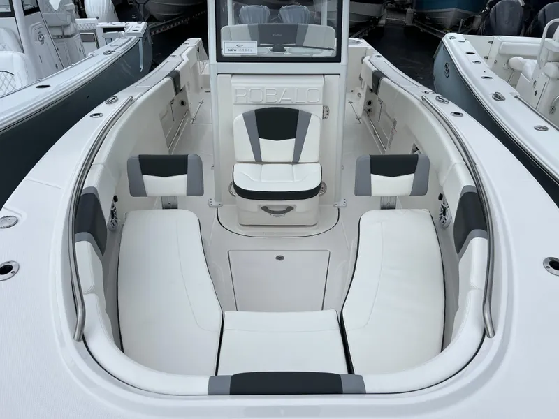 Slide: The Image of 2024 Robalo R270 boat interior with white seating and sleek design. - 10