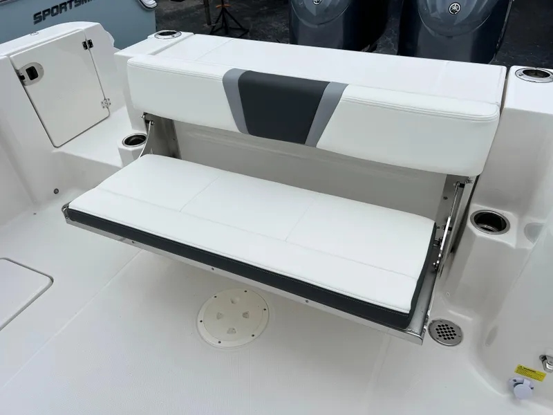 Slide: The Image of 2024 Robalo R270 boat with foldable white and gray seating. - 13
