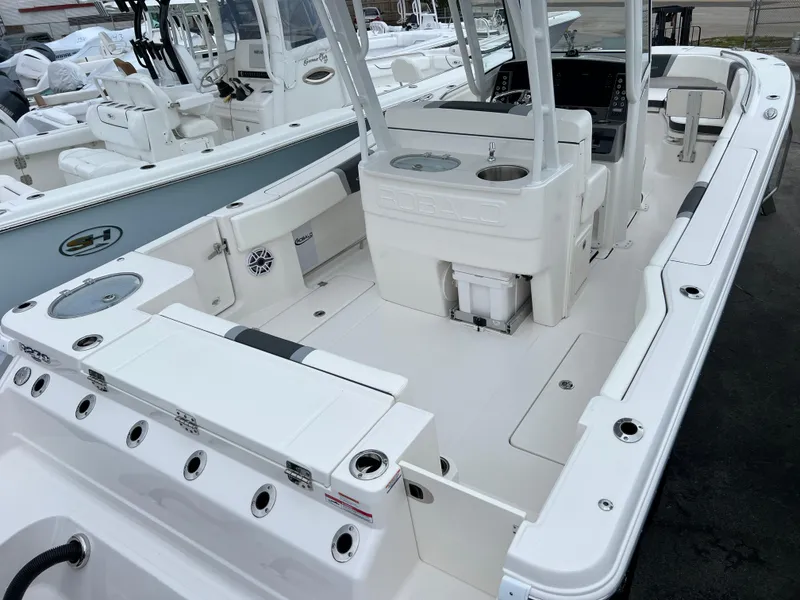 Slide: The Image of 2024 Robalo R270 boat interior with spacious deck and seating. - 4