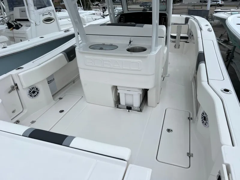 Slide: The Image of 2024 Robalo R270 boat interior with spacious deck and seating area. - 5