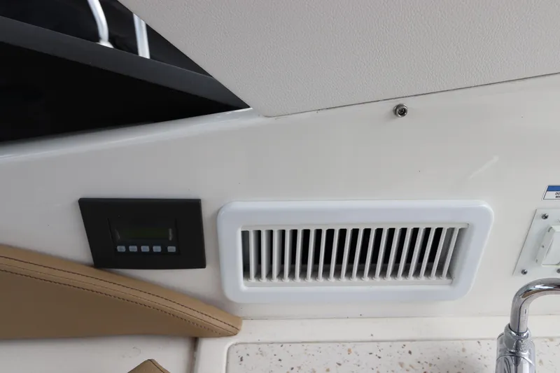 Slide: The Image of Control panel and vent on 2019 Sea Ray Sundancer 320 boat interior. - 13