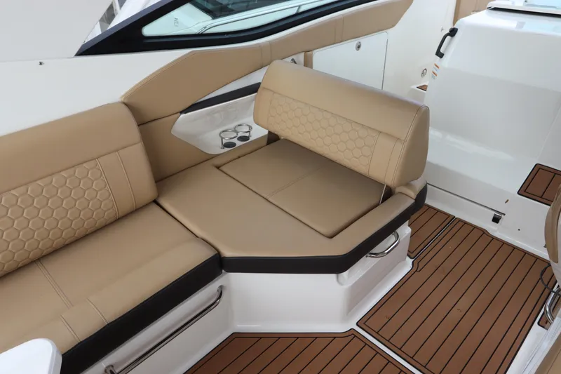 Slide: The Image of Luxurious seating area on 2019 Sea Ray Sundancer 320 boat with tan upholstery. - 14