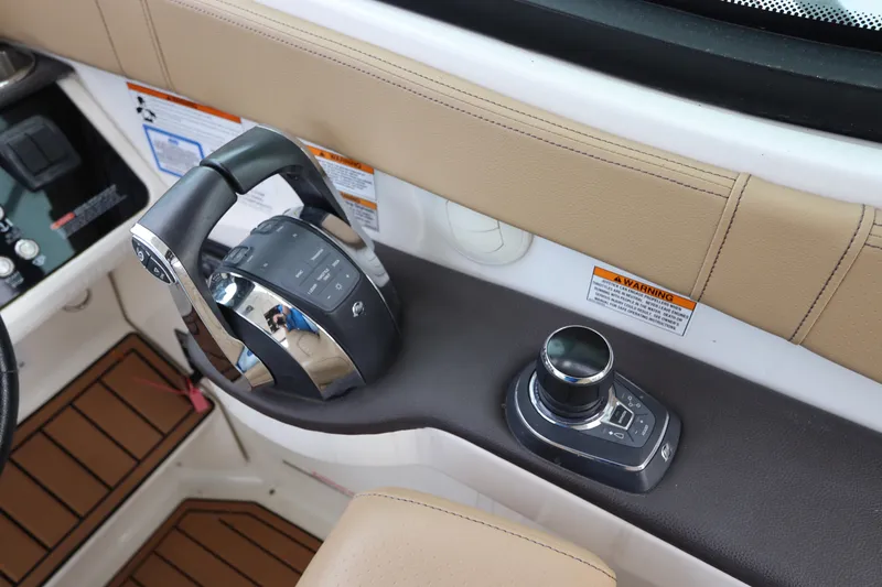 Slide: The Image of Control panel of 2019 Sea Ray Sundancer 320 boat with joystick and throttle. - 19