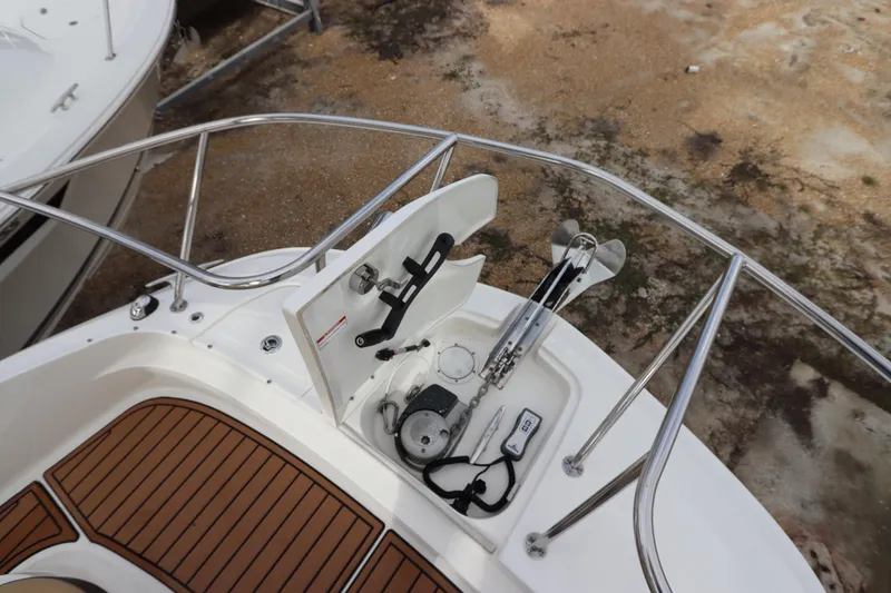 Slide: The Image of 2019 Sea Ray Sundancer 320 bow with anchor and teak deck details. - 28