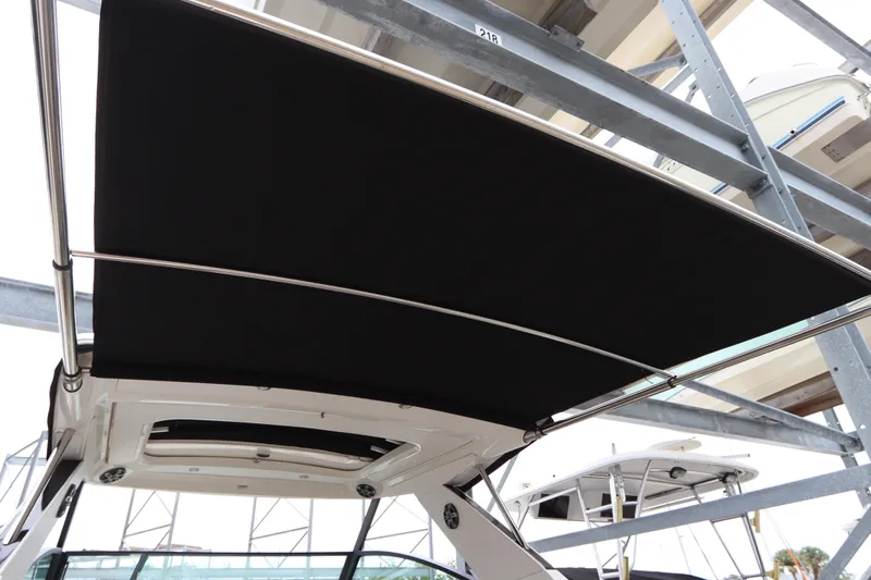 Slide: The Image of 2019 Sea Ray Sundancer 320 with extended black canvas top. - 31