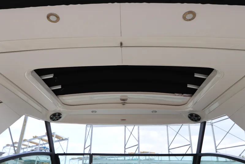 Slide: The Image of 2019 Sea Ray Sundancer 320 boat interior ceiling with speakers and lighting. - 32