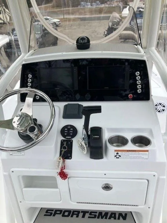 Slide: The Image of 2019 Sportsman 227 MASTERS boat console with steering wheel and electronic displays. - 3