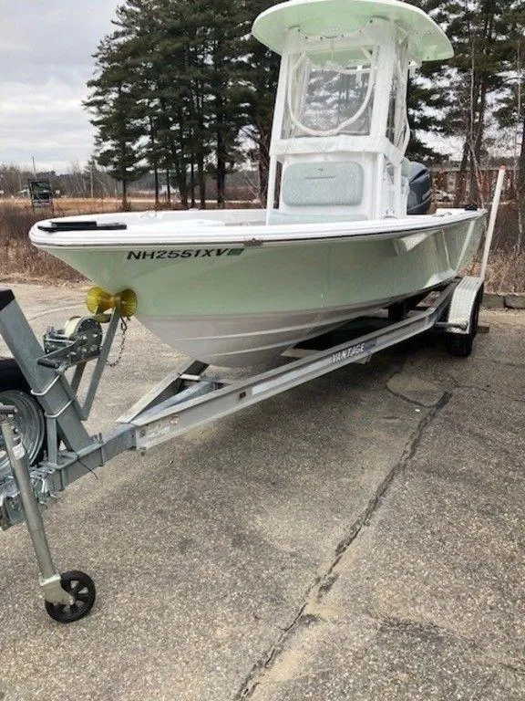 Slide: The Image of 2019 Sportsman 227 MASTERS boat on a trailer in a parking lot. - 5