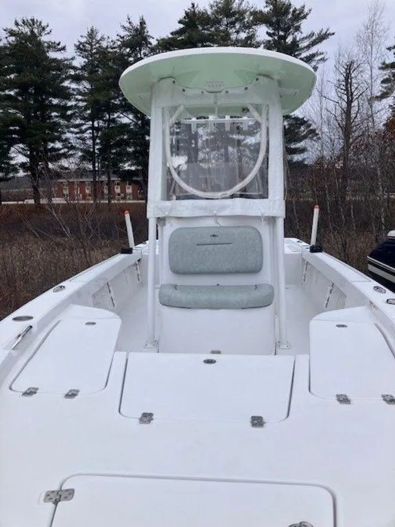 Slide: The Image of 2019 Sportsman 227 MASTERS boat with center console and seating, docked outdoors. - 6