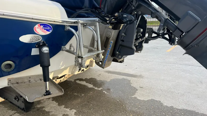 Slide: The Image of 2005 NauticStar 2200 boat stern with motor and trim tabs. - 10