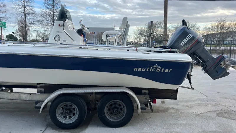 Slide: The Image of 2005 NauticStar 2200 boat on trailer with Yamaha outboard motor. - 7