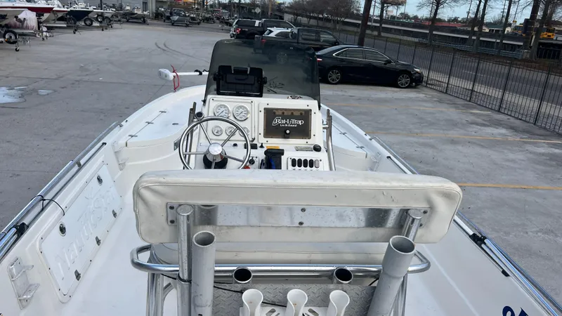 Slide: The Image of 2005 NauticStar 2200 boat interior with steering console and seating. - 8