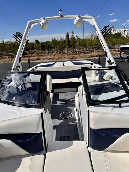 Slide: The Image of 2024 Axis A20 boat interior with open seating and sleek design. - 11
