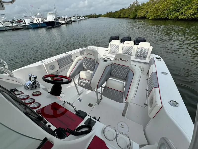 Slide: The Image of 2008 Donzi 38 ZSF boat interior with luxurious seating and control panel. - 11
