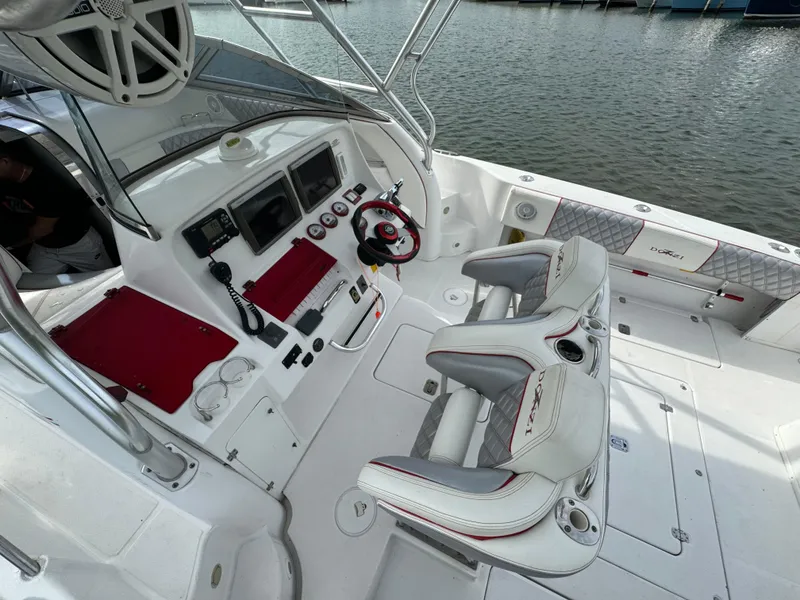 Slide: The Image of 2008 Donzi 38 ZSF boat cockpit with dual seats and navigation controls. - 12