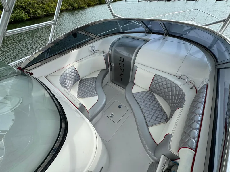 Slide: The Image of 2008 Donzi 38 ZSF boat interior with cushioned seating and water view. - 15