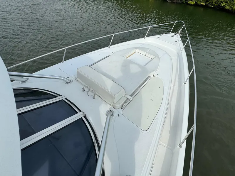 Slide: The Image of 2008 Donzi 38 ZSF boat deck with railing on calm water. - 17