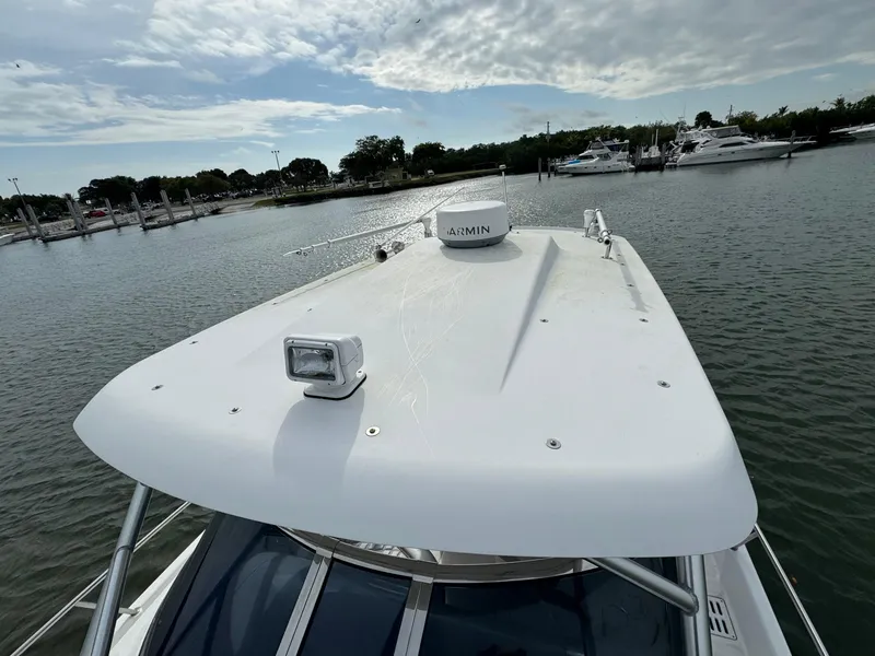 Slide: The Image of 2008 Donzi 38 ZSF boat docked in a marina. - 21